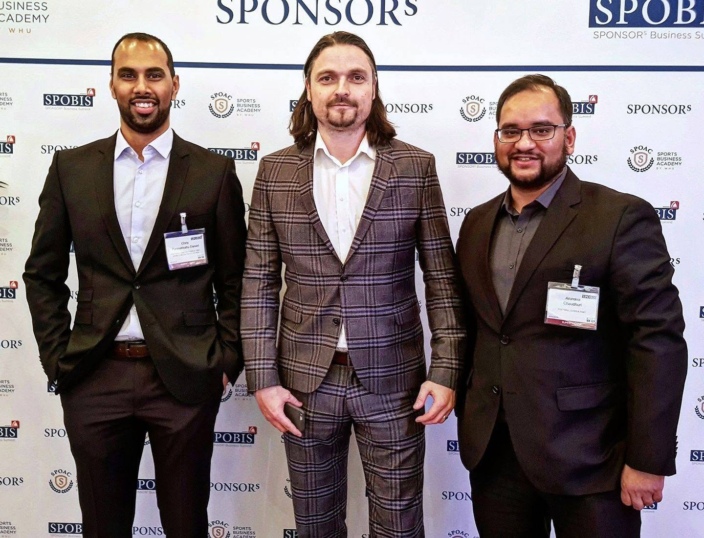 Chris Punnakkattu Daniel alongside former St. Louis CITY SC and current Aberdeen FC Sporting Director Lutz Pfannenstiel and Arunava Chaudhuri at the SPOBIS sports business conference.